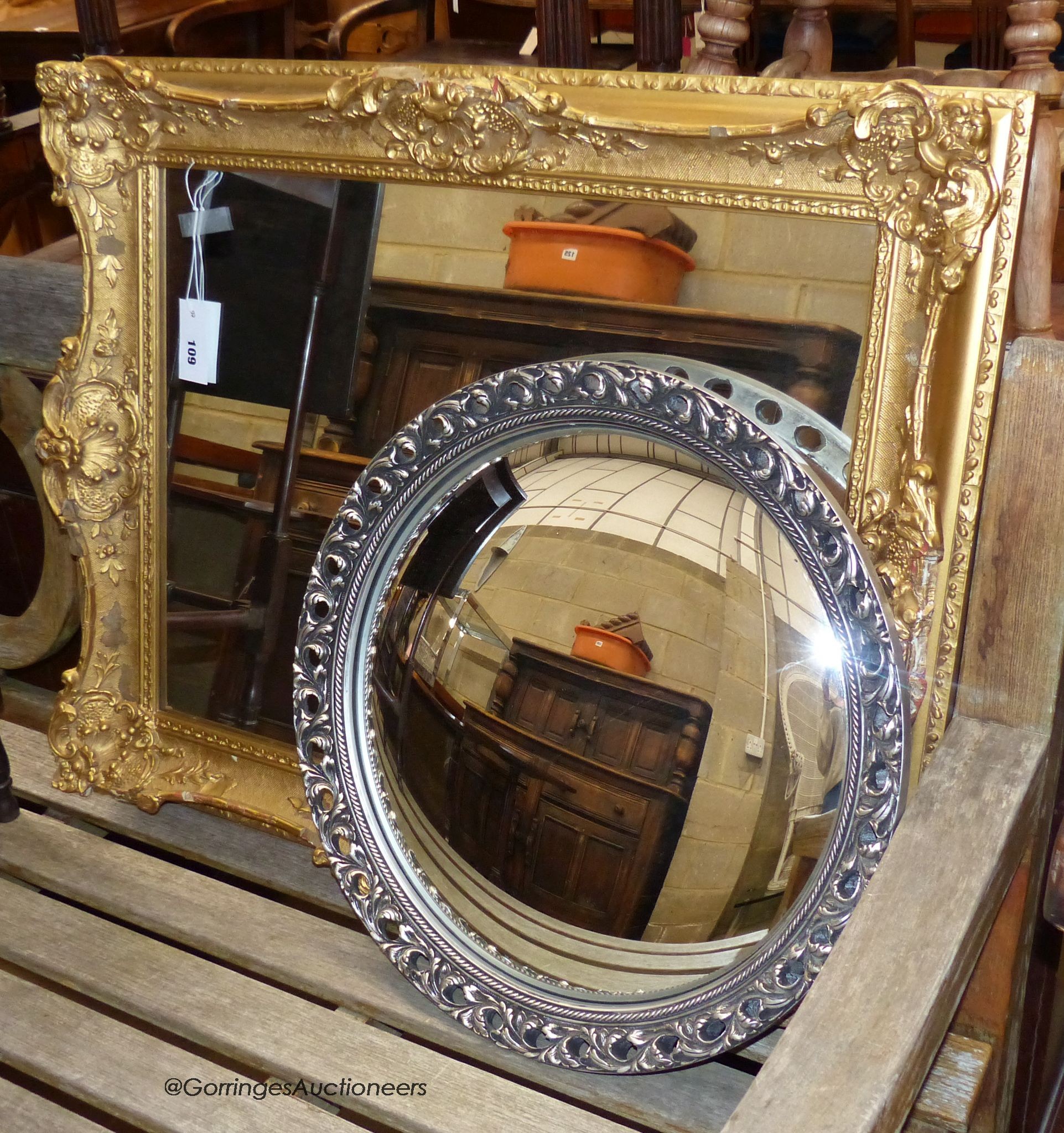A rectangular gilt and gesso wall mirror, width 82cm, height 72cm together with a later circular convex wall mirror